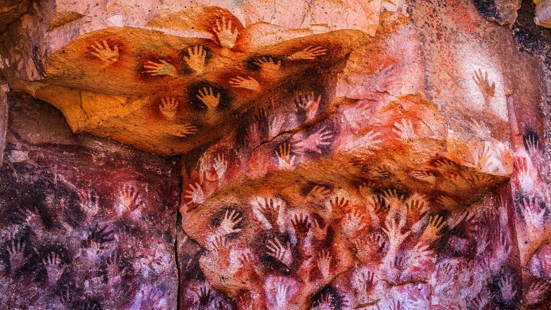 The numerous hand stencils of Cueva de las Manos, Argentina. The hand  prints of many different people separated by hundreds or thousands of  years, their stories lost to time but their art